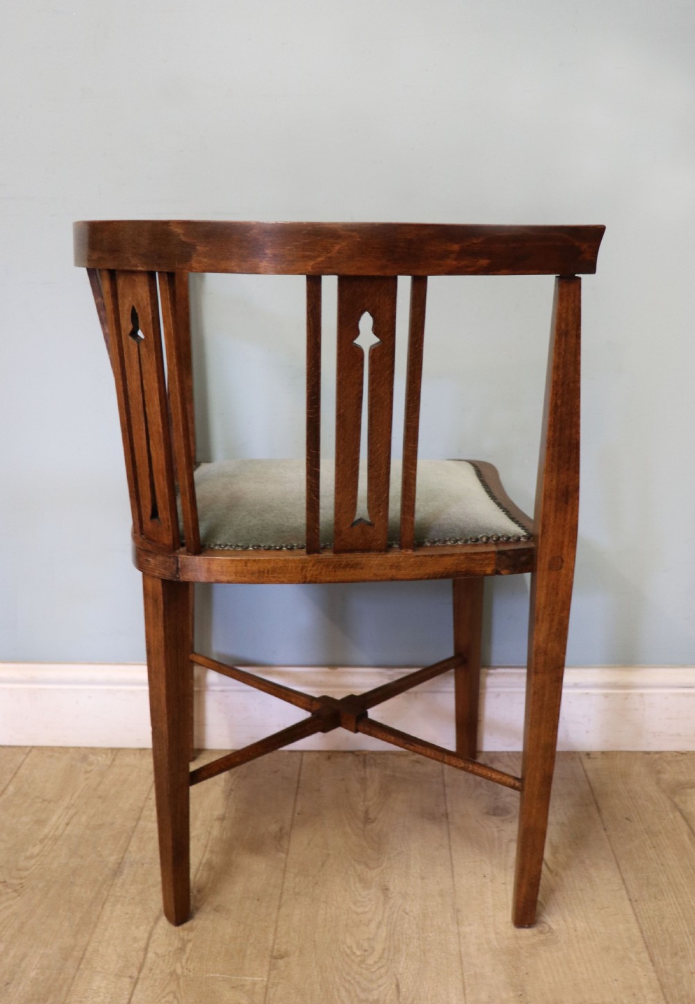 A pair of antique mahogany corner chairs featuring boxwood line inlay, pierced back splats, cross-braced legs, and green upholstered seats with stud trim. View XII