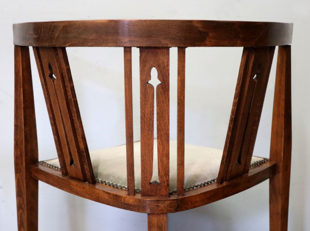 A pair of antique mahogany corner chairs featuring boxwood line inlay, pierced back splats, cross-braced legs, and green upholstered seats with stud trim. View XXI