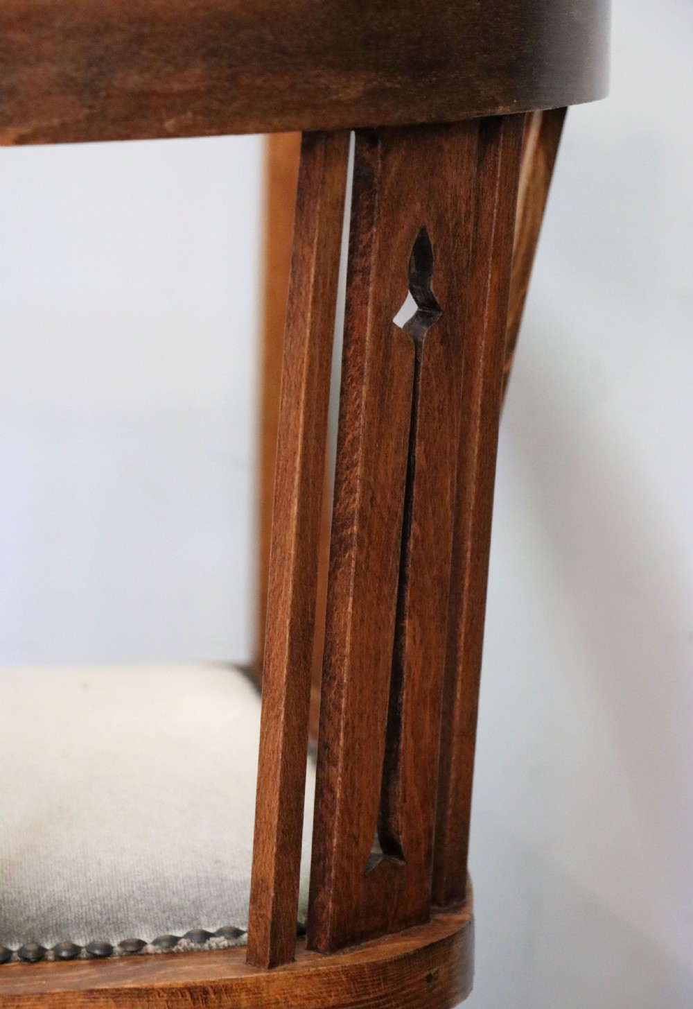 A pair of antique mahogany corner chairs featuring boxwood line inlay, pierced back splats, cross-braced legs, and green upholstered seats with stud trim. View XXIV