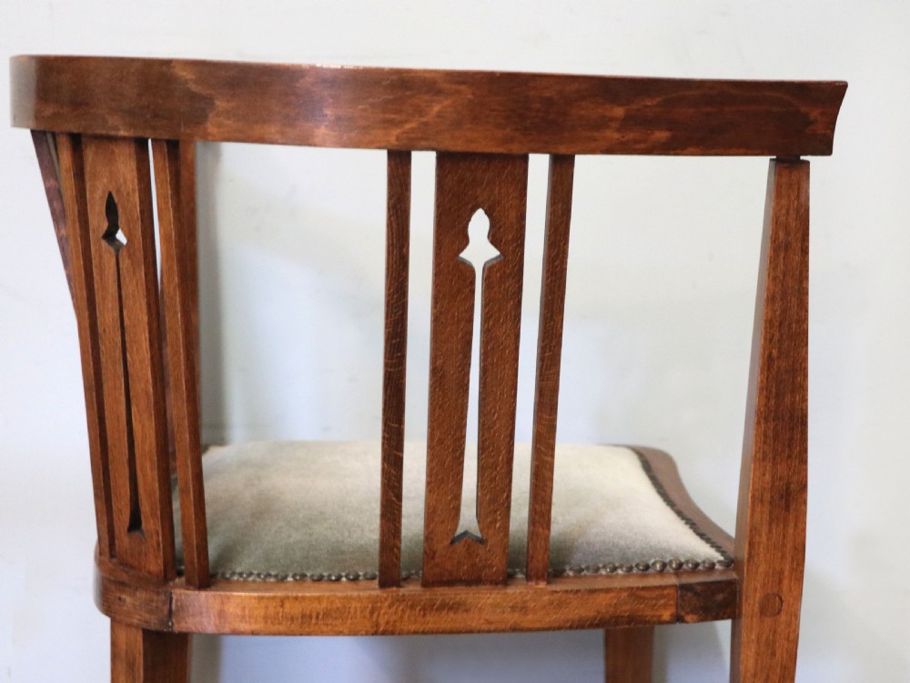 A pair of antique mahogany corner chairs featuring boxwood line inlay, pierced back splats, cross-braced legs, and green upholstered seats with stud trim. View XXVI