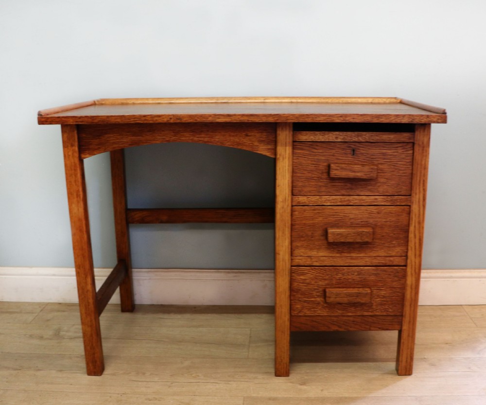 A vintage oak child’s desk.