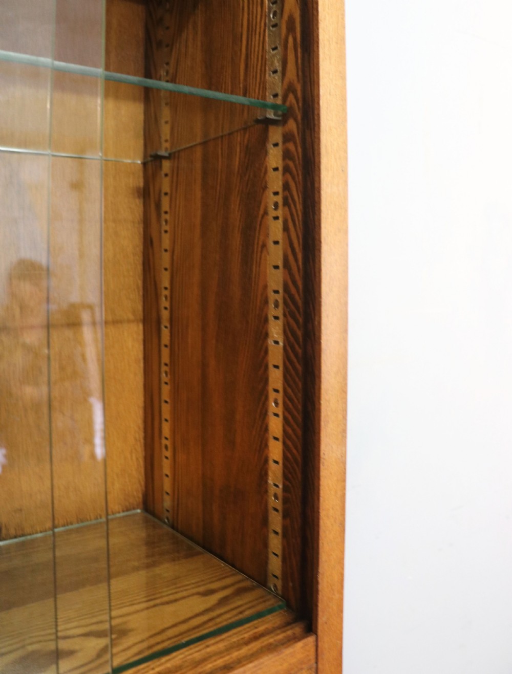  A 1930s/ 1940s oak bookcase or display cabinet decorated with the Associated Television logo. View VIII