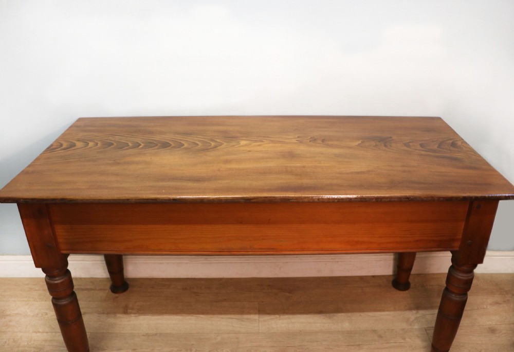 A Victorian stained pine table featuring an elm top and turned legs, shown against a plain background. View II