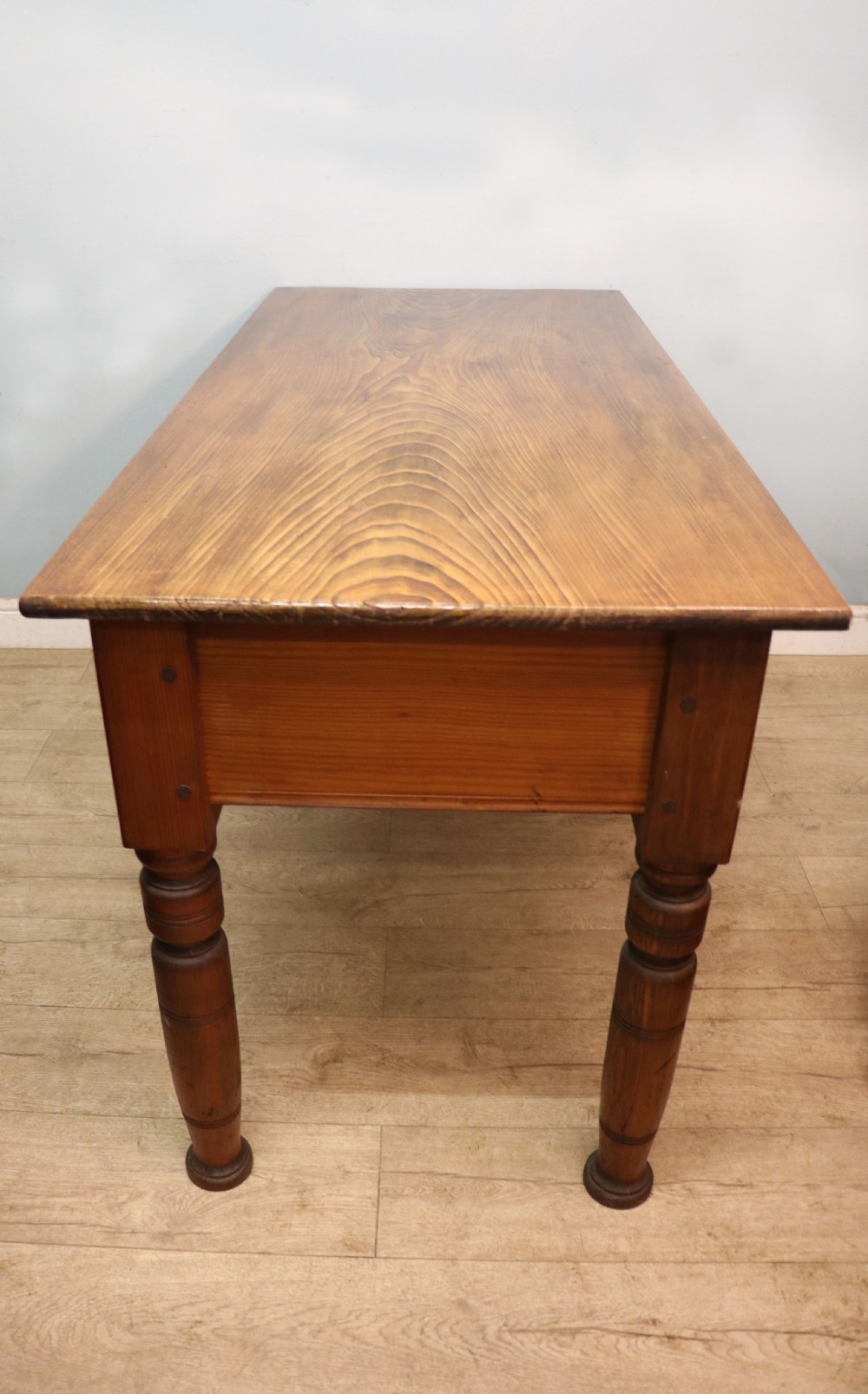 A Victorian stained pine table featuring an elm top and turned legs, shown against a plain background. View IV