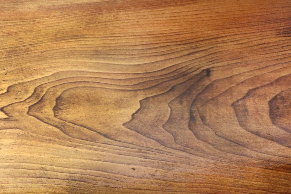A Victorian stained pine table featuring an elm top and turned legs, shown against a plain background. View VII