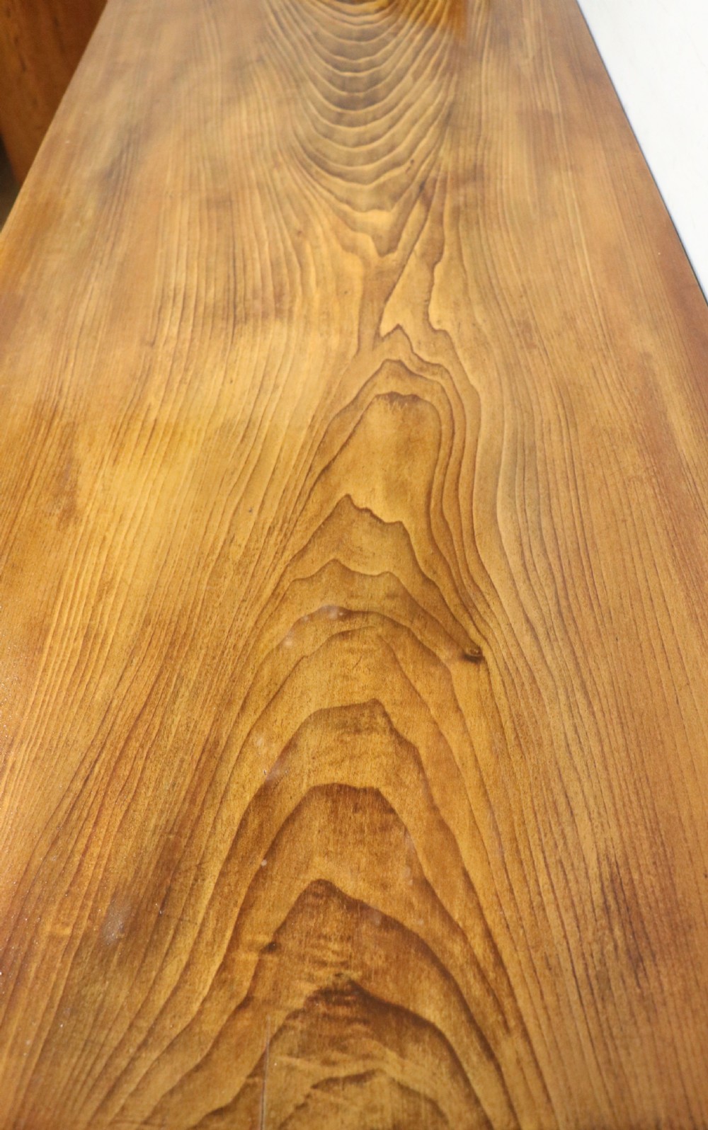 A Victorian stained pine table featuring an elm top and turned legs, shown against a plain background. View X