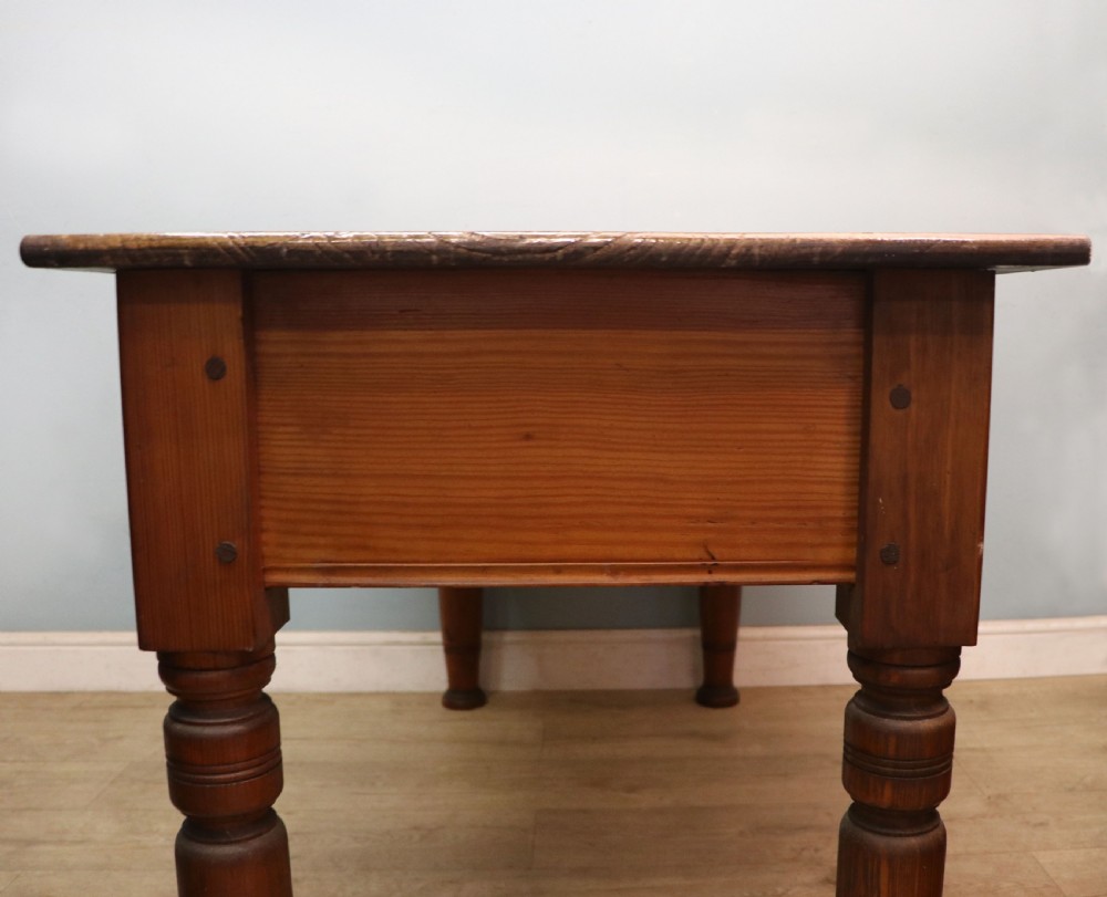 A Victorian stained pine table featuring an elm top and turned legs, shown against a plain background. View XI