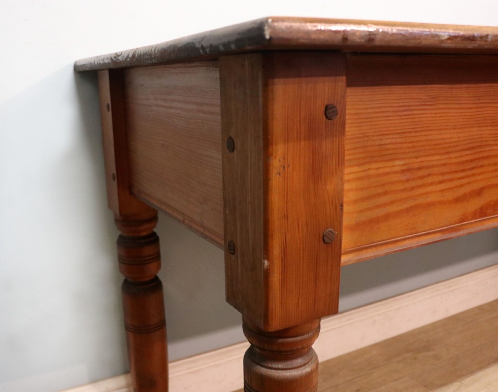A Victorian stained pine table featuring an elm top and turned legs, shown against a plain background. View XII