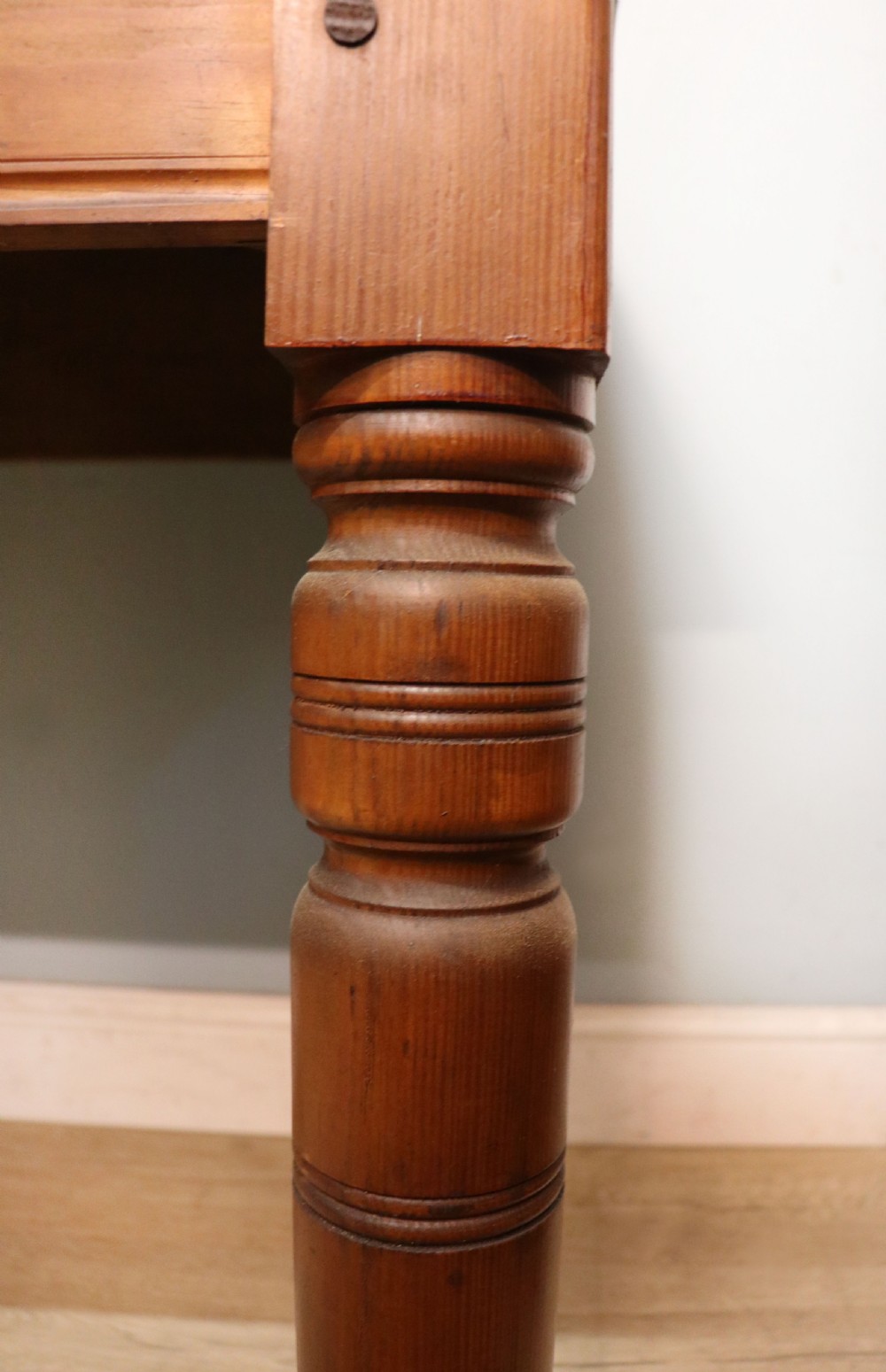 A Victorian stained pine table featuring an elm top and turned legs, shown against a plain background. View XIV
