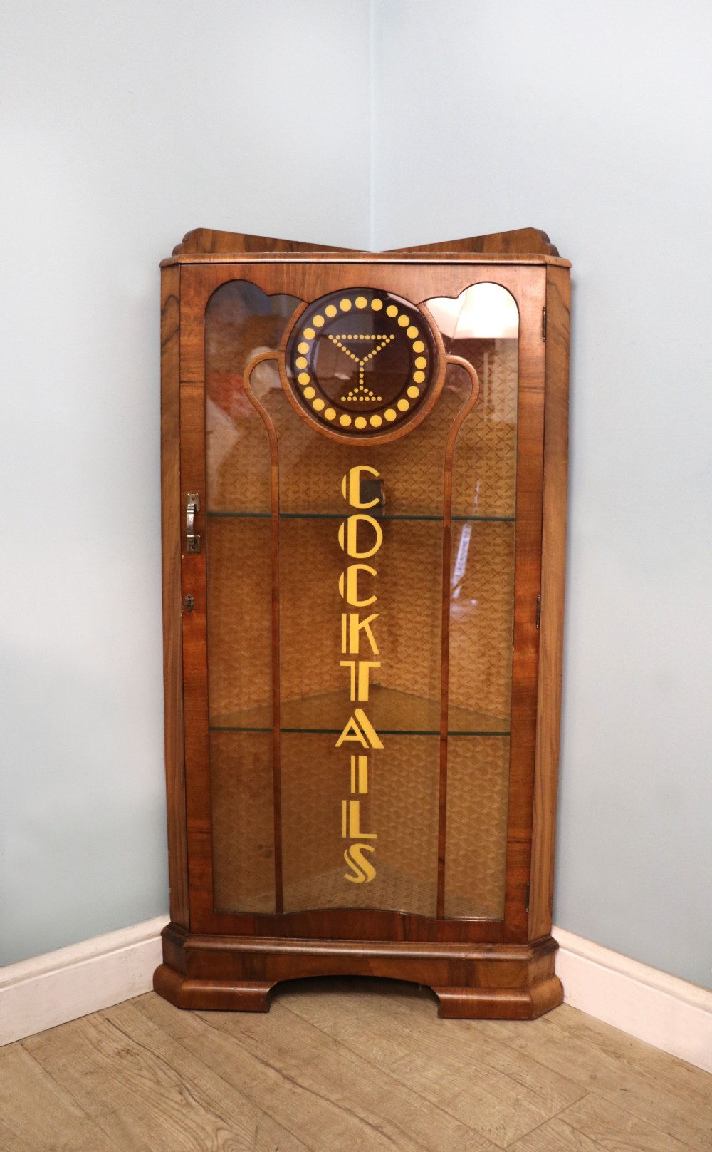Art Deco period corner display cabinet later sign written for Cocktails.