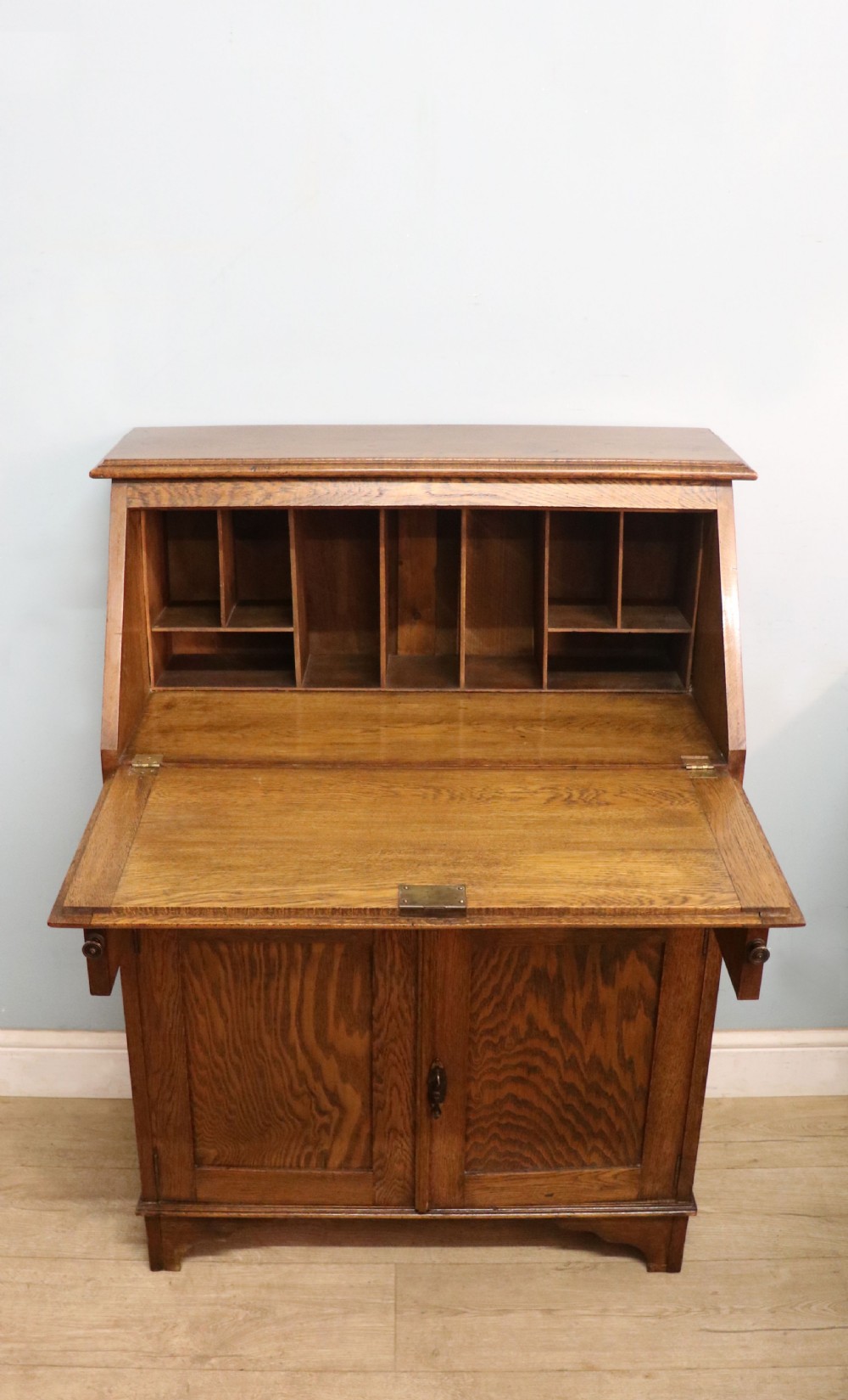 A late Victorian oak bureau in the Arts and Crafts style.  View II