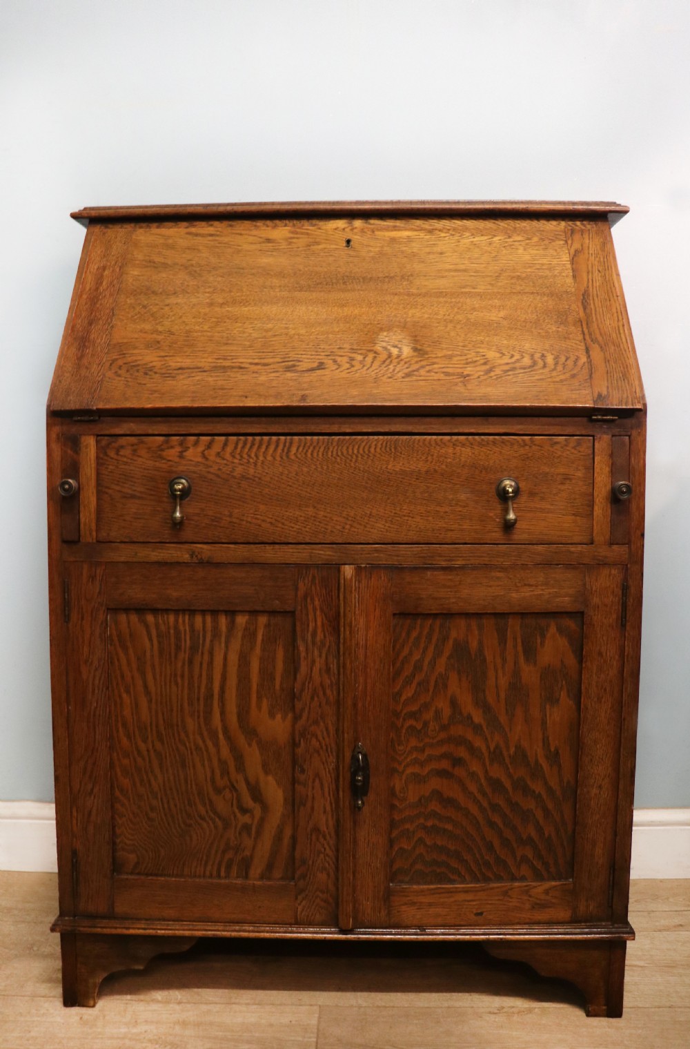 A late Victorian oak bureau in the Arts and Crafts style.  View III
