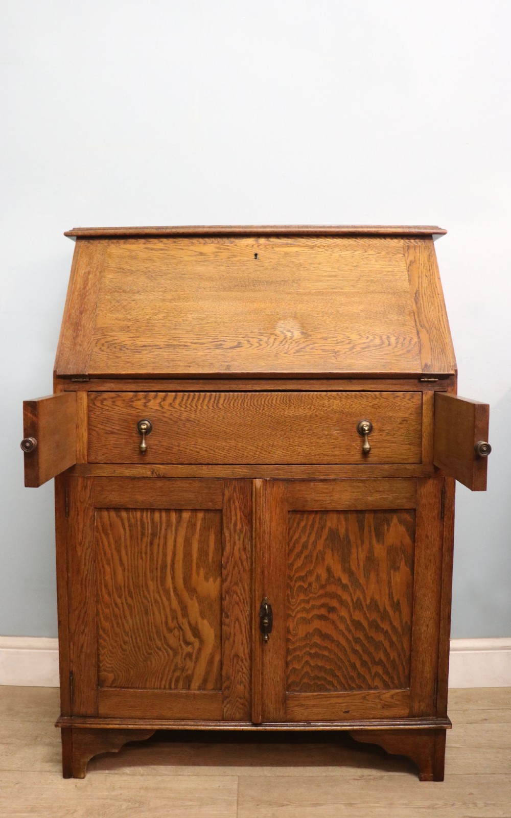 A late Victorian oak bureau in the Arts and Crafts style.  View IV