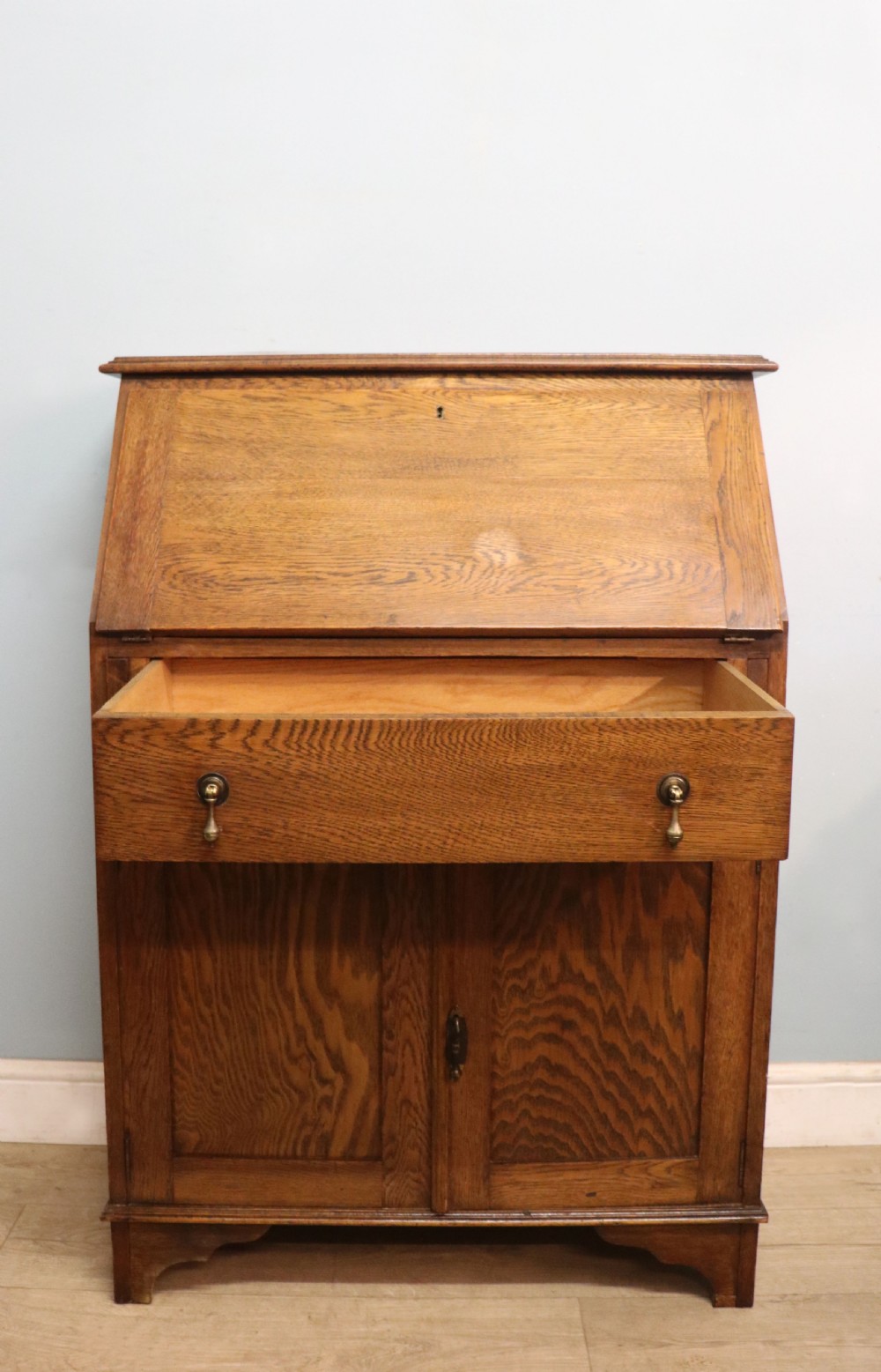 A late Victorian oak bureau in the Arts and Crafts style.  View V