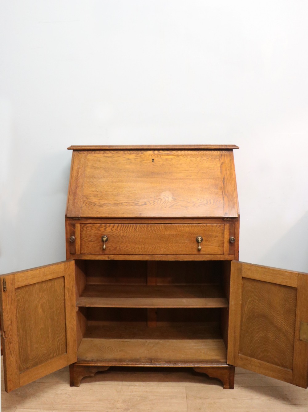 A late Victorian oak bureau in the Arts and Crafts style.  View VII