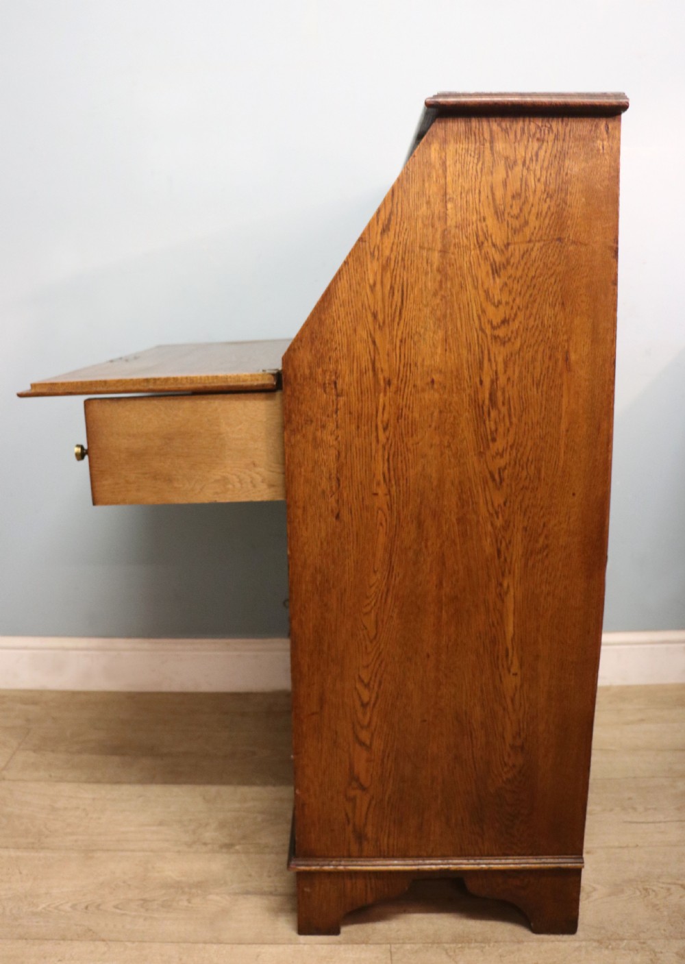 A late Victorian oak bureau in the Arts and Crafts style.  View VIII
