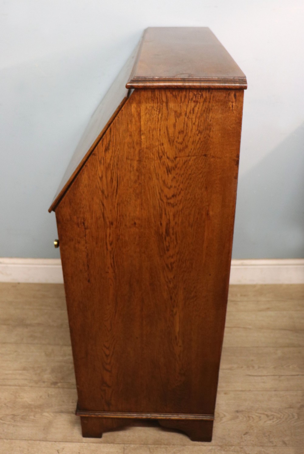 A late Victorian oak bureau in the Arts and Crafts style.  View IX