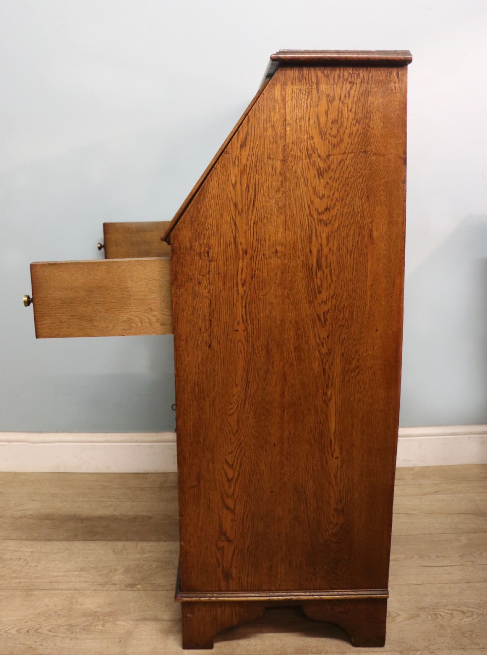 A late Victorian oak bureau in the Arts and Crafts style.  View X