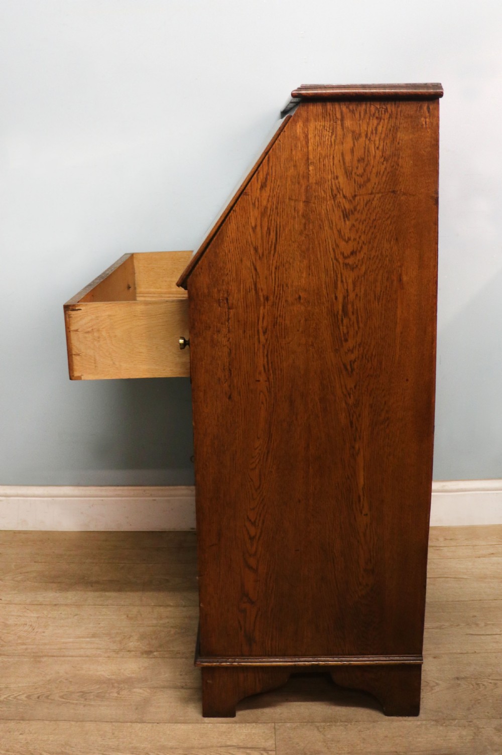 A late Victorian oak bureau in the Arts and Crafts style.  View XI
