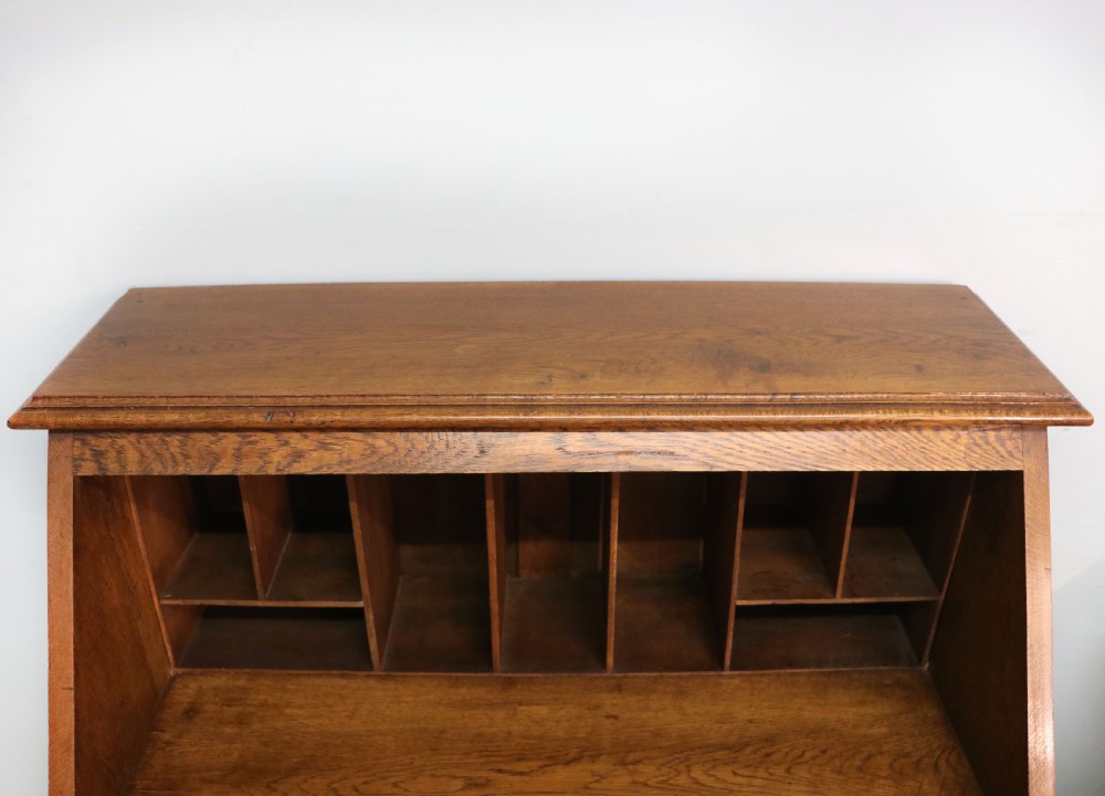 A late Victorian oak bureau in the Arts and Crafts style.  View XIII