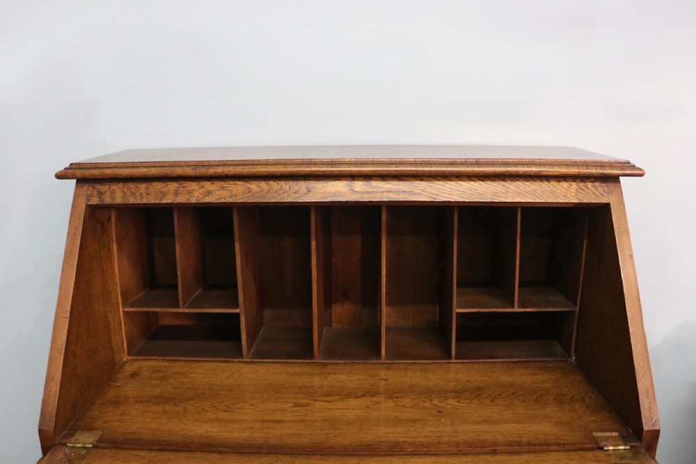 A late Victorian oak bureau in the Arts and Crafts style.  View XIV