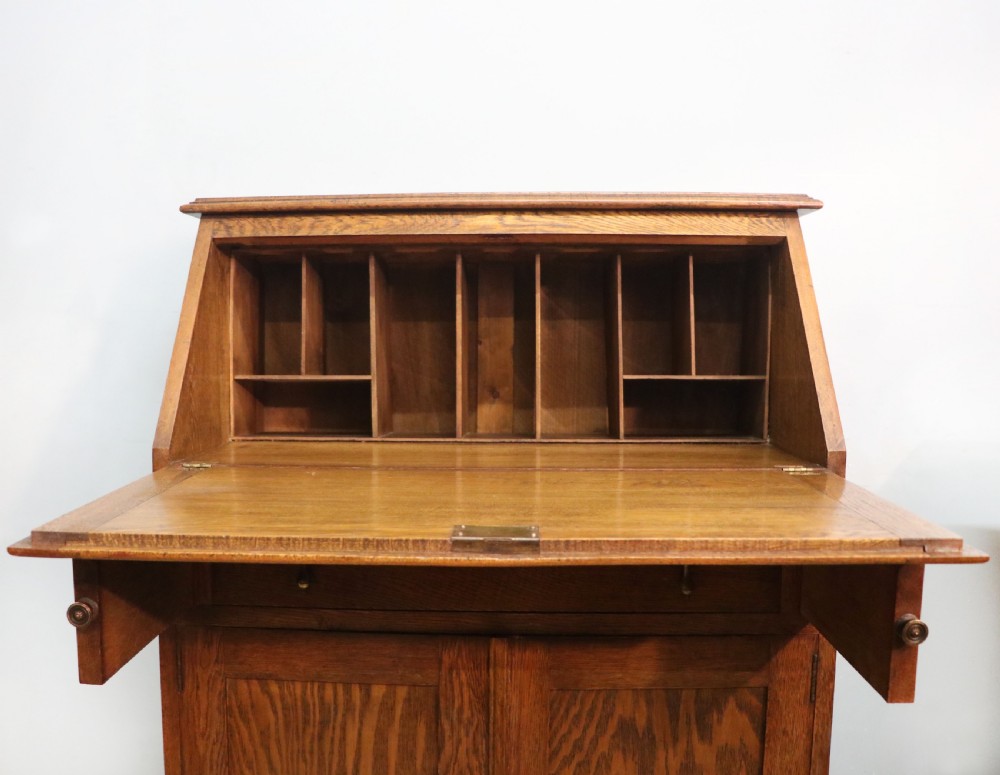 A late Victorian oak bureau in the Arts and Crafts style.  View XV