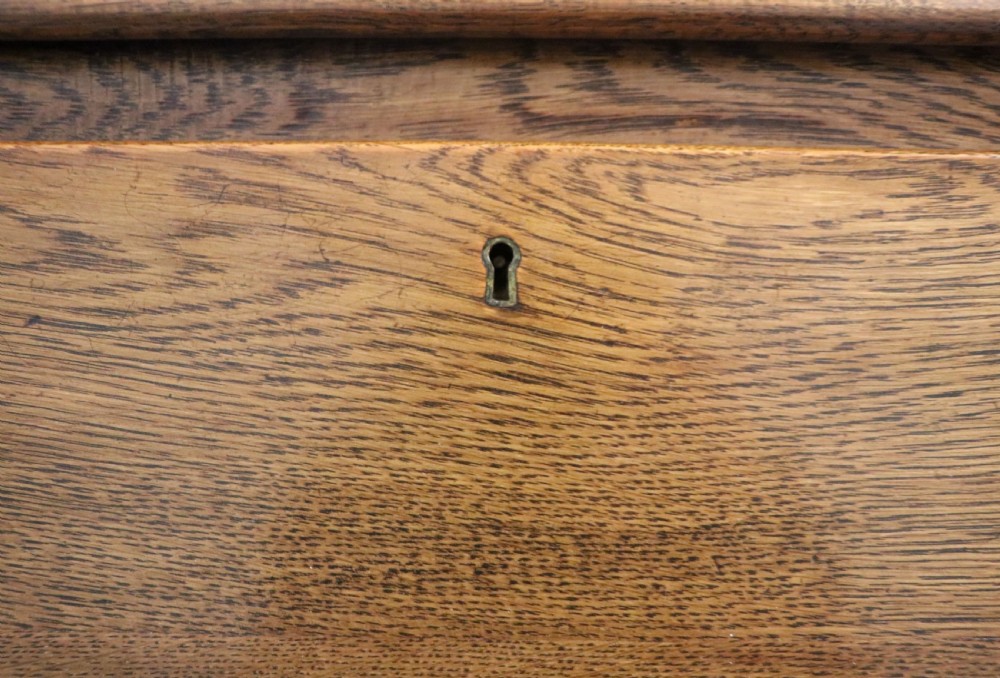 A late Victorian oak bureau in the Arts and Crafts style.  View XVI