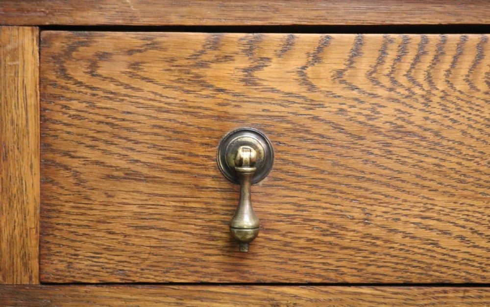 A late Victorian oak bureau in the Arts and Crafts style.  View XXVIII