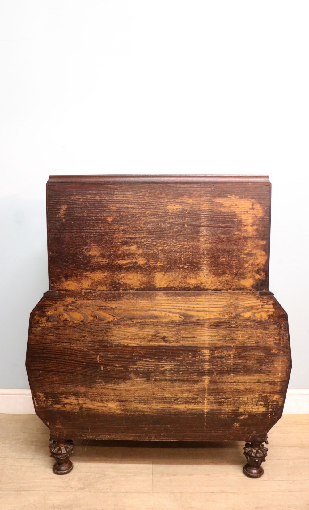 A dark oak fall-front bureau with octagonal geometric cupboard doors, carved details, turned gadrooned feet, and an open fitted stationery compartment. View XIII