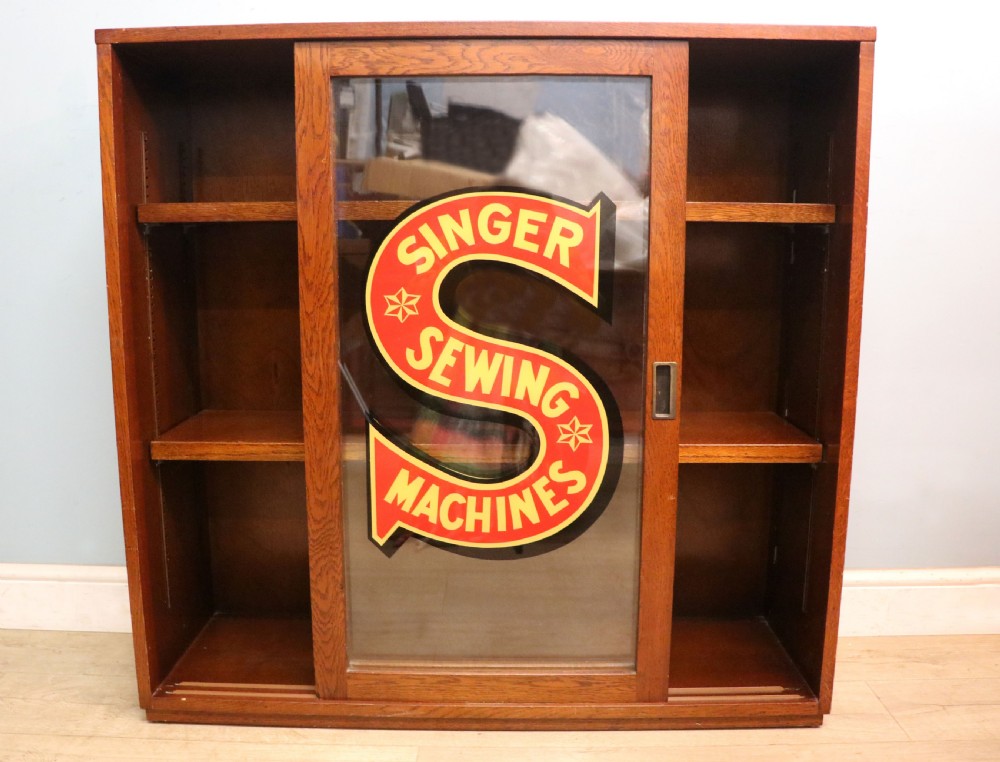 A lovely early 20th century oak framed display cabinet sign written for Singer Sewing Machines. View IV