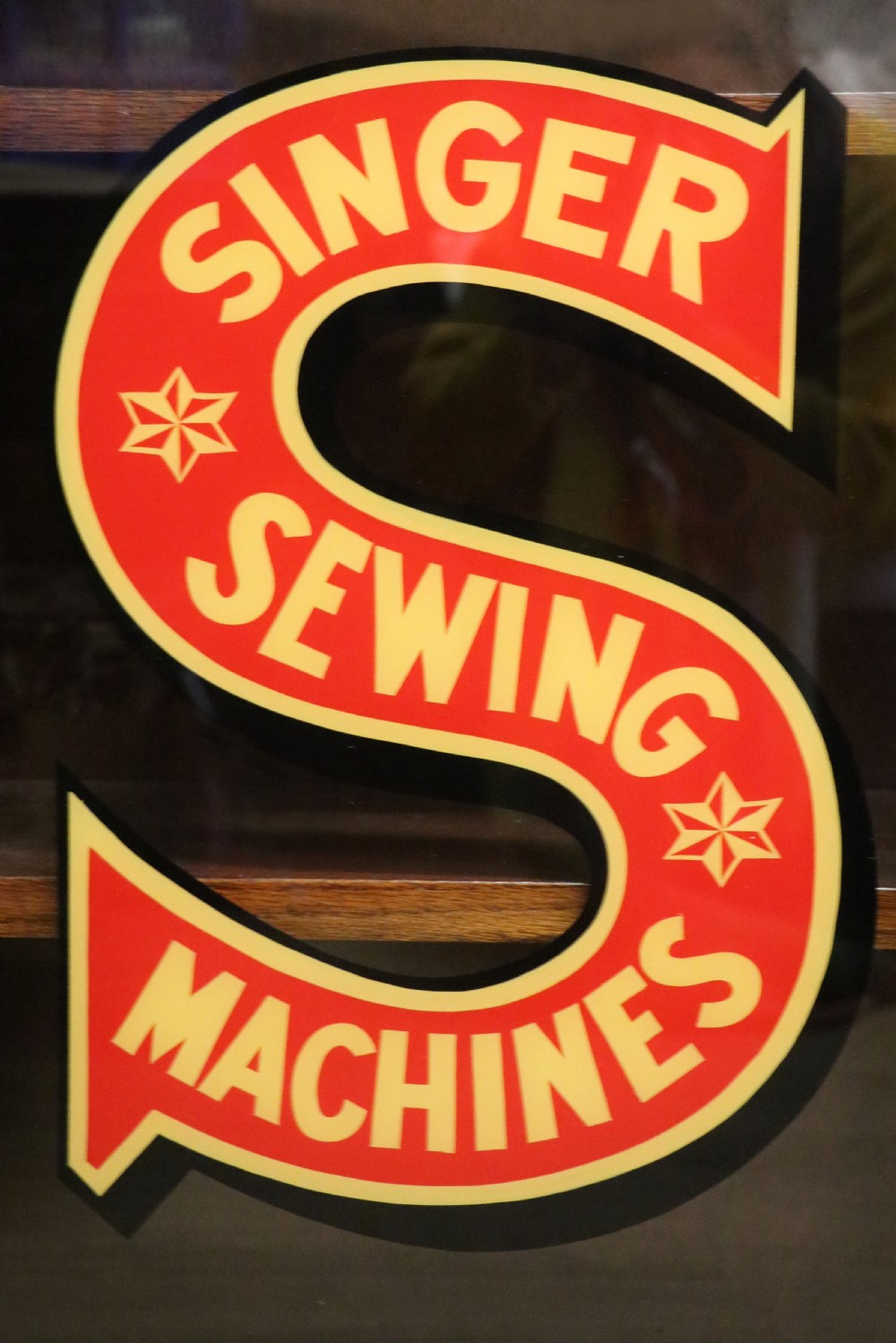 A lovely early 20th century oak framed display cabinet sign written for Singer Sewing Machines. View XV