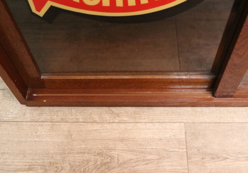 A lovely early 20th century oak framed display cabinet sign written for Singer Sewing Machines. View XXII