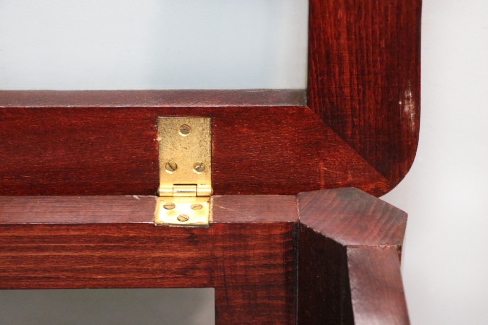 A French Louis XV style glazed bijouterie table in dark hardwood with cabriole legs, gilt metal mounts, and blue Breitling lettering on the glass top. View XXIII