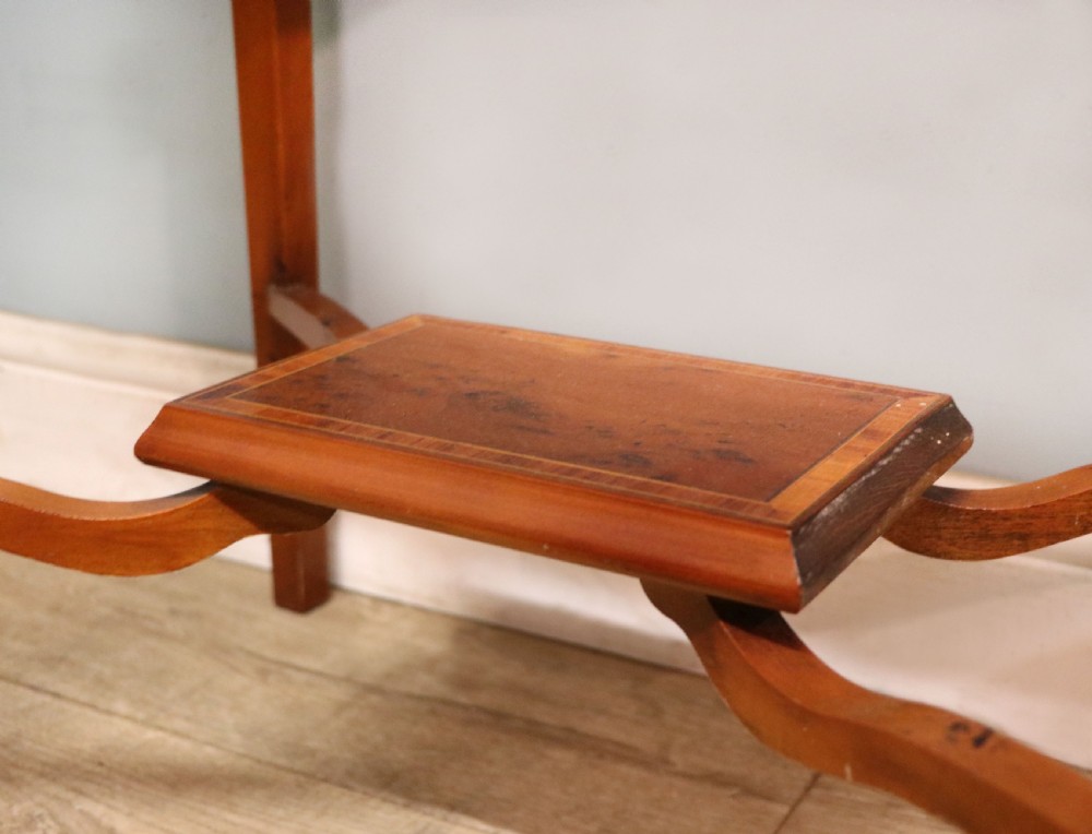A glazed yew wood bijouterie display table featuring a green velvet interior lining, lower undertier, and Breitling 1884 logo printed on the top glass. View XXI