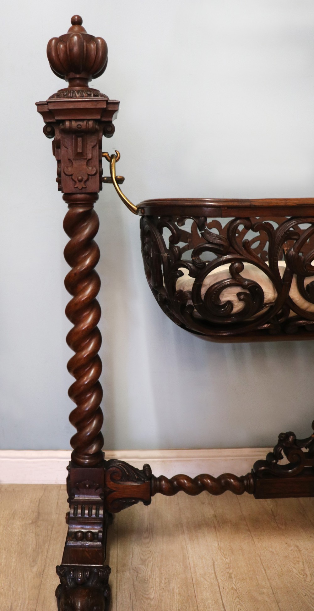 A lovely Victorian rocking baby’s crib with the finest elaborate pierced fretwork oak frame. View II