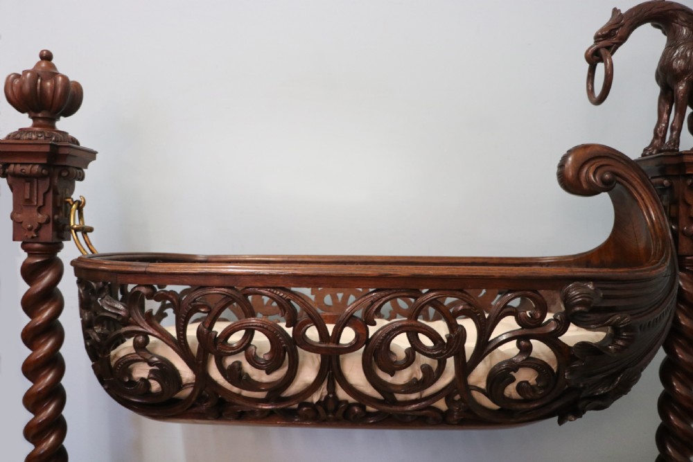 A lovely Victorian rocking baby’s crib with the finest elaborate pierced fretwork oak frame. View IV