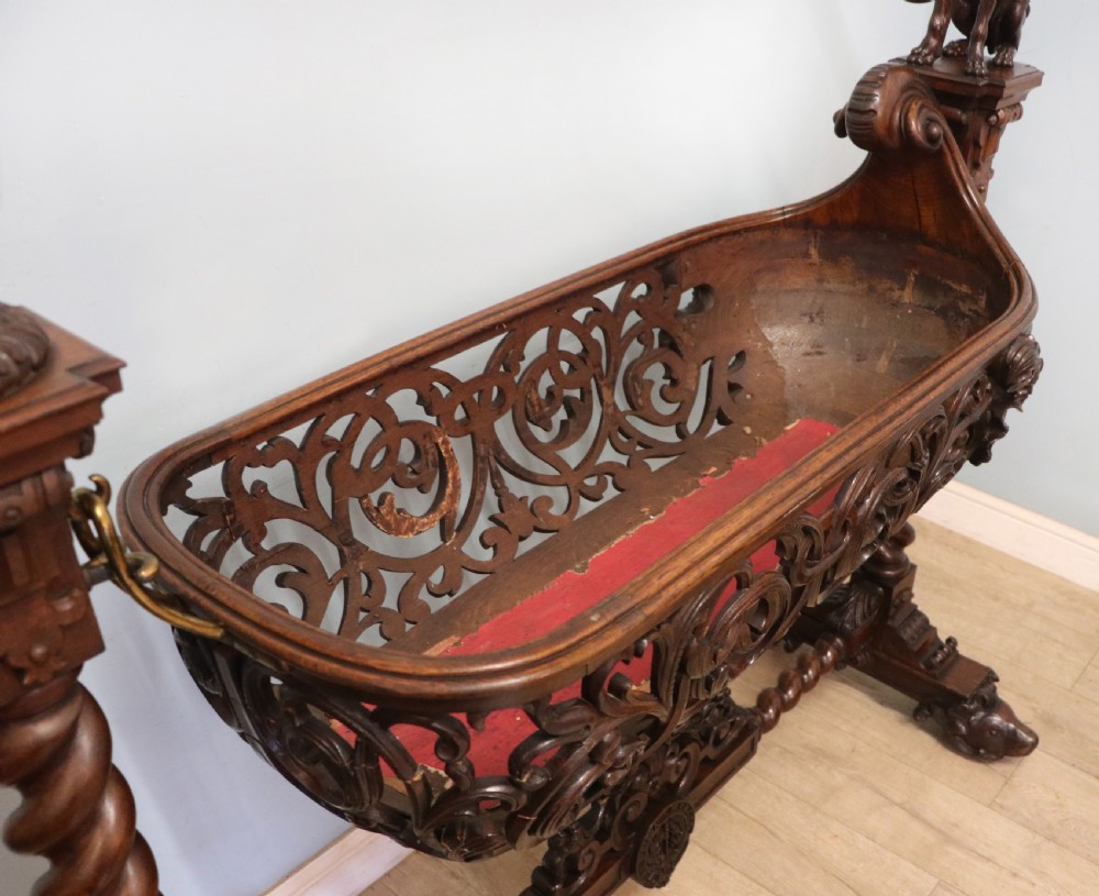 A lovely Victorian rocking baby’s crib with the finest elaborate pierced fretwork oak frame. View V