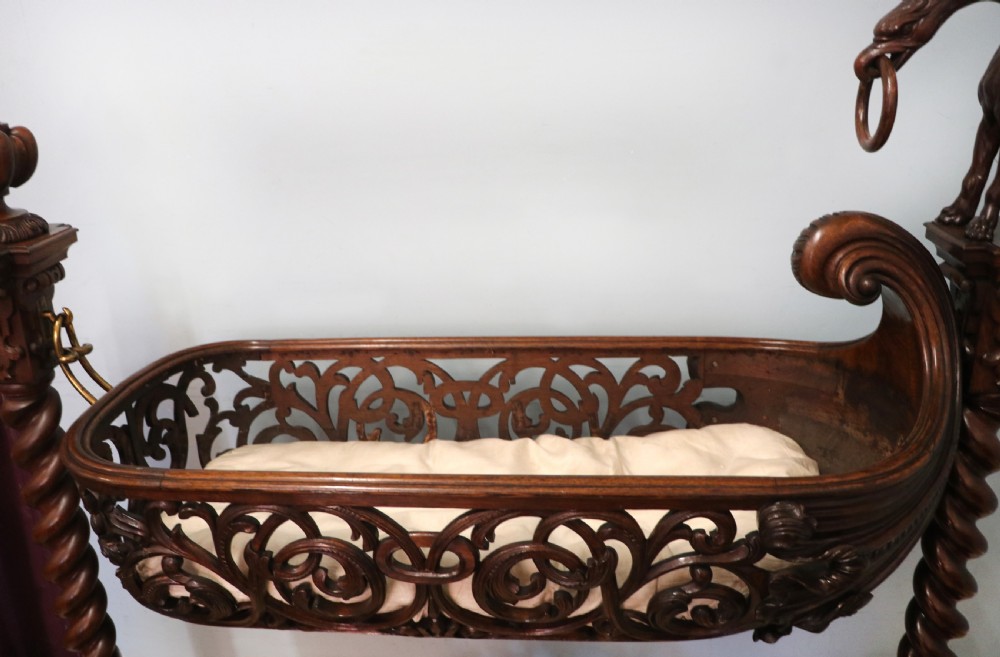 A lovely Victorian rocking baby’s crib with the finest elaborate pierced fretwork oak frame. View VII