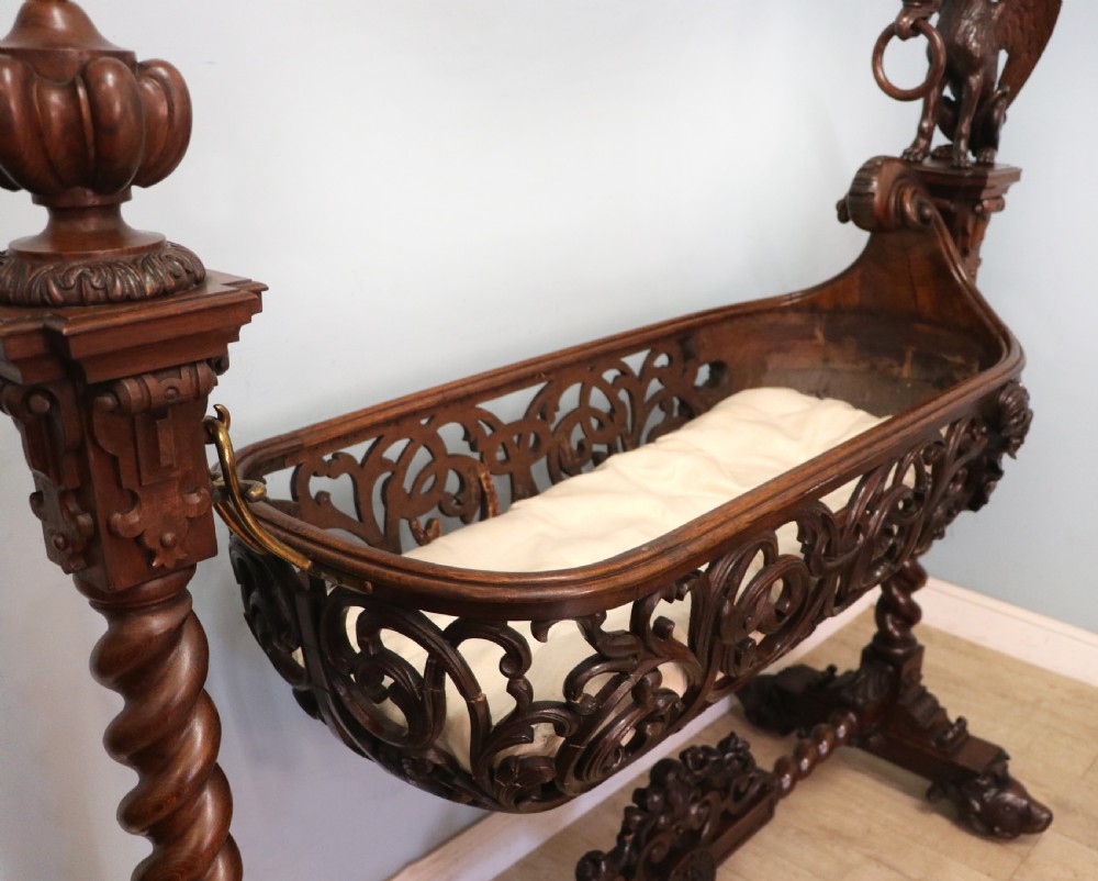 A lovely Victorian rocking baby’s crib with the finest elaborate pierced fretwork oak frame. View VIII
