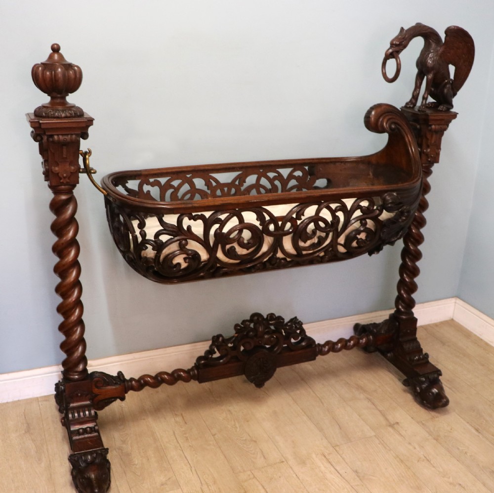 A lovely Victorian rocking baby’s crib with the finest elaborate pierced fretwork oak frame. View IX