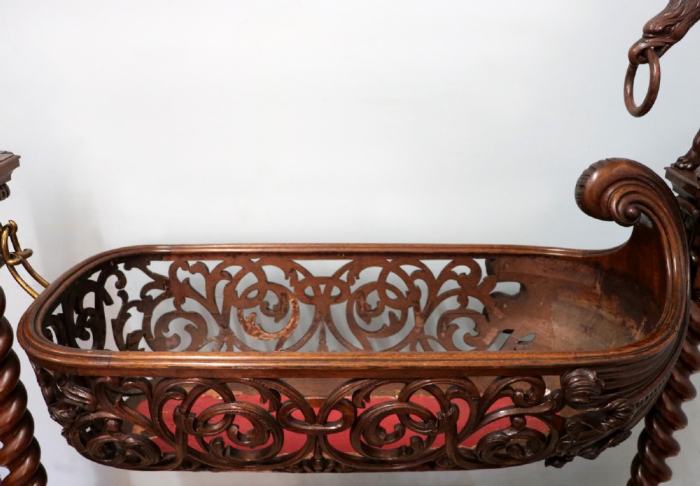 A lovely Victorian rocking baby’s crib with the finest elaborate pierced fretwork oak frame. View XV