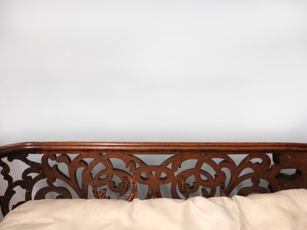 A lovely Victorian rocking baby’s crib with the finest elaborate pierced fretwork oak frame. View XVI