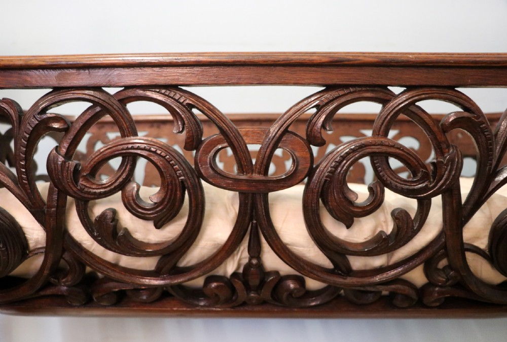 A lovely Victorian rocking baby’s crib with the finest elaborate pierced fretwork oak frame. View XVIII
