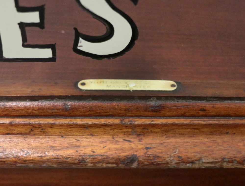 A glazed hardwood countertop display cabinet with sign-written lettering for Rowntrees Elect Cocoa and OXO Cubes on the front glass panel. View XVII