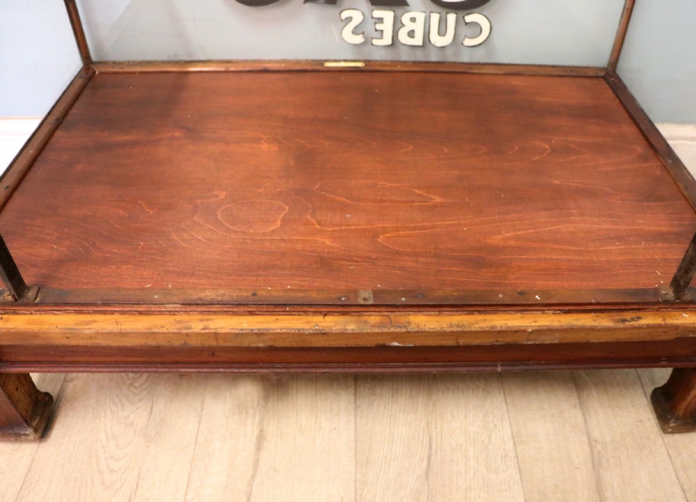A glazed hardwood countertop display cabinet with sign-written lettering for Rowntrees Elect Cocoa and OXO Cubes on the front glass panel. View XIX