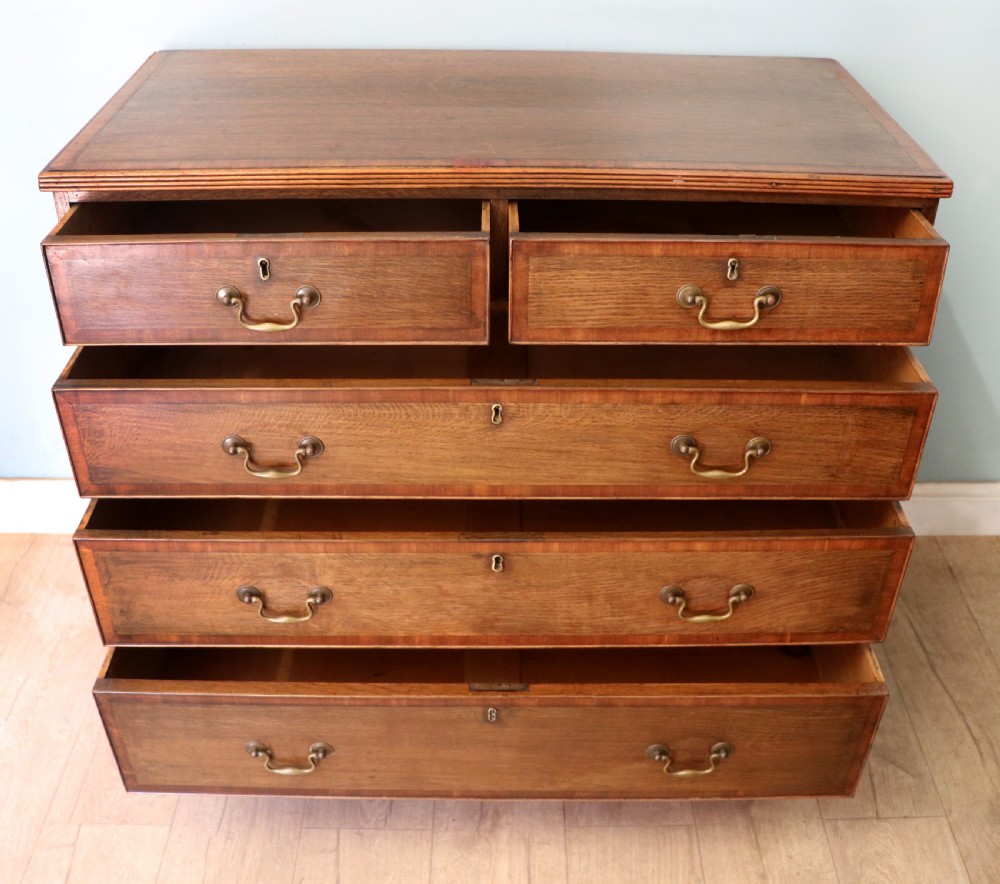 A lovely understated George III oak and mahogany crossbanded chest of drawers.  View II