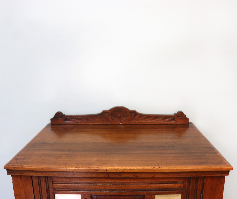 A late Victorian American walnut cabinet, later sign written for G.Hall of London. View VI