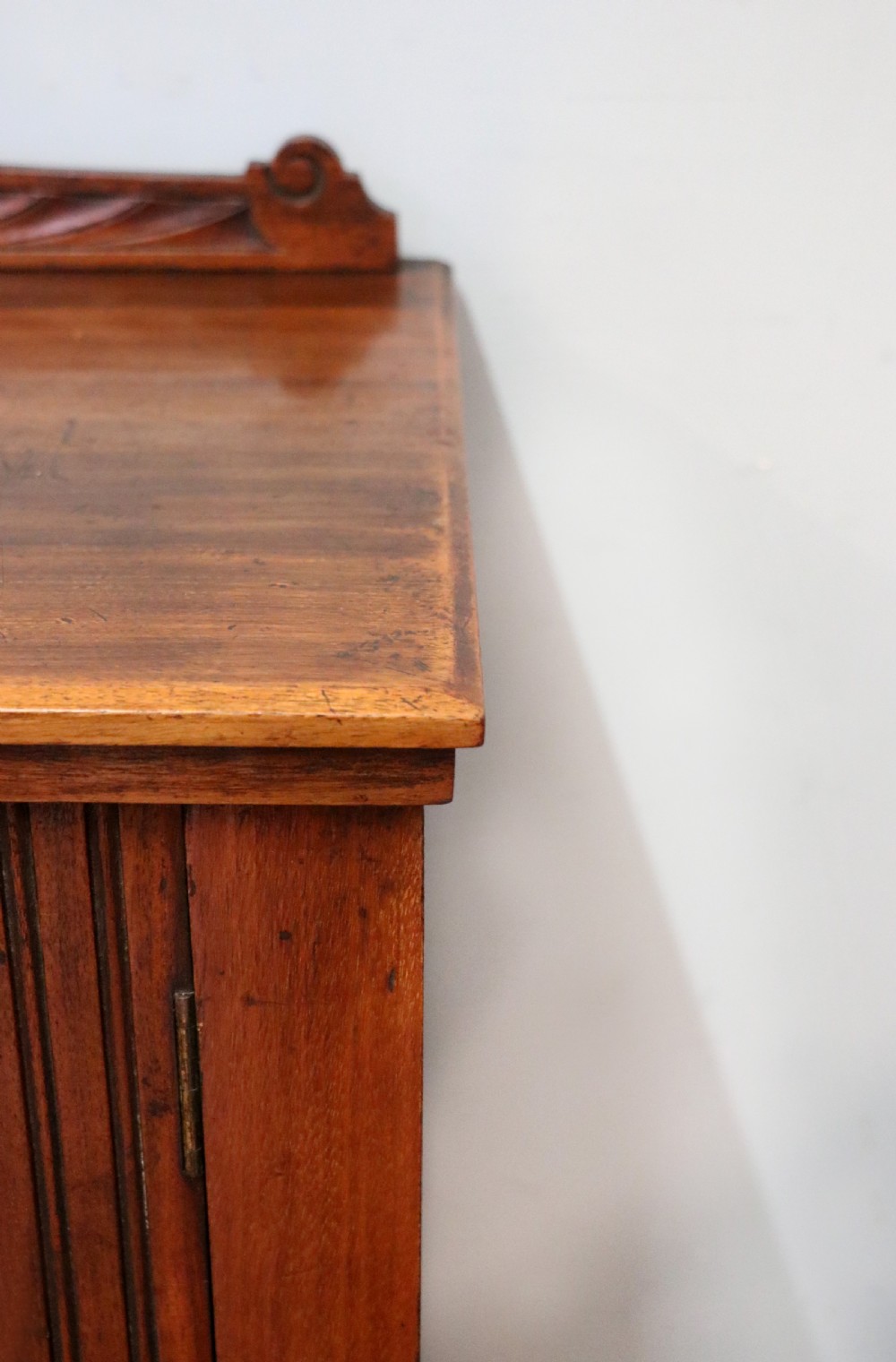 A late Victorian American walnut cabinet, later sign written for G.Hall of London. View X