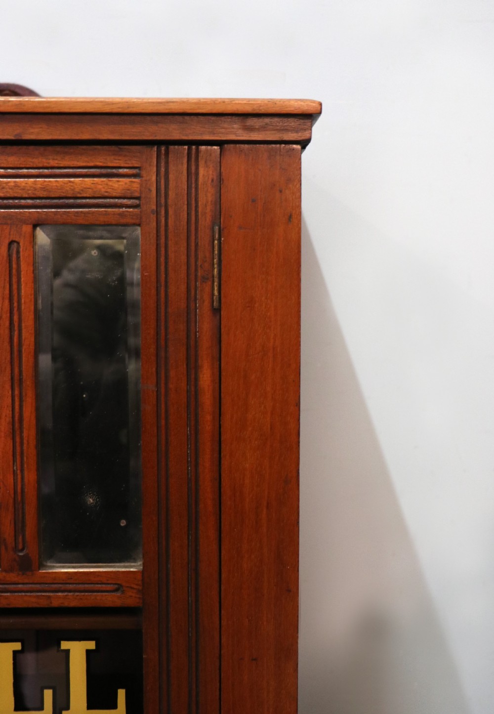 A late Victorian American walnut cabinet, later sign written for G.Hall of London. View XVIII