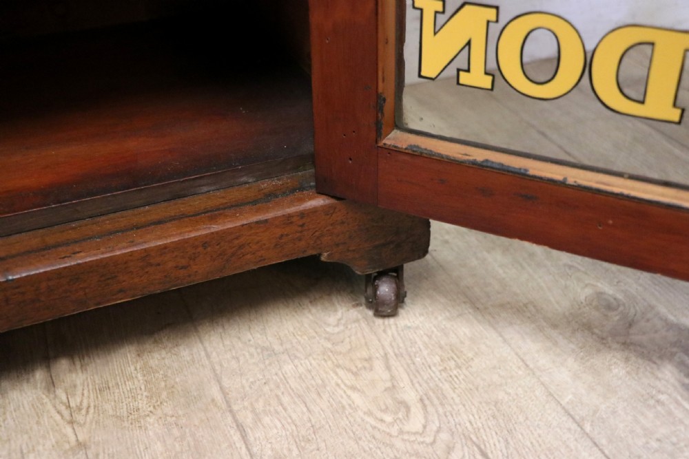 A late Victorian American walnut cabinet, later sign written for G.Hall of London. View XXII